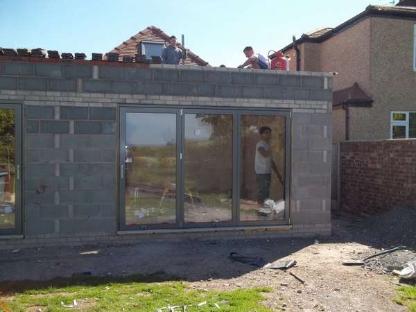 Mr & Mrs B. - Helsby, Cheshire : Installtion of Alstyle Marine Finish Alumnium Bi Fold doors Triple glazed with 44mm sealed units. Flush Floor track. Hydrolic magnetic closures